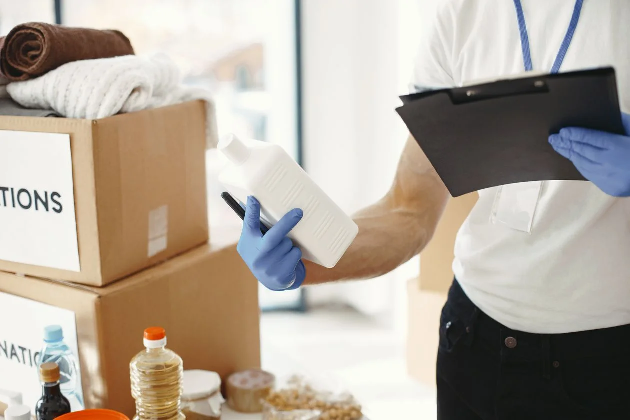Person sorting goods at a distribution center — inventory financing applied in Indonesian industries
