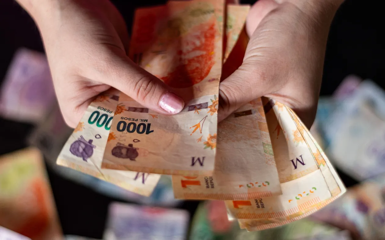 Close-up of banknotes being counted by hand